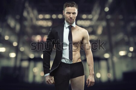 Handsome young man with great tuxedo Stock photo © konradbak