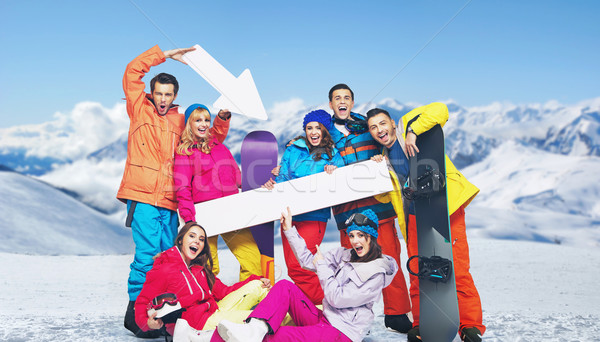 Laughing snowboarders with the mountains in the background Stock photo © konradbak