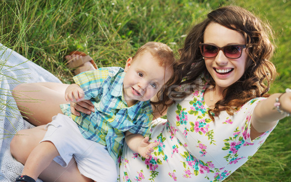 Woman with fabulous smile and her cute son Stock photo © konradbak