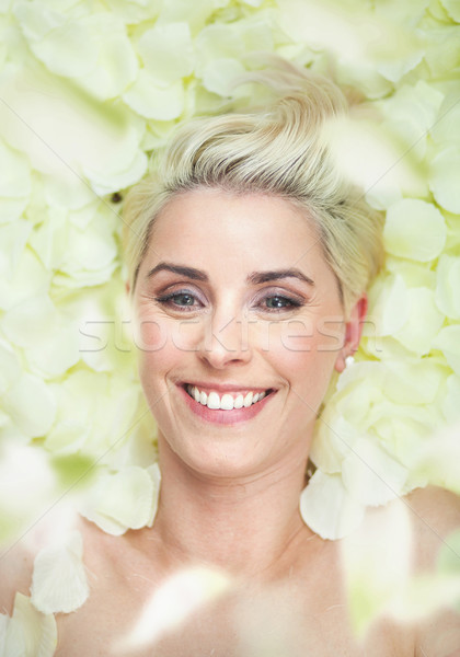 Attractive Short Hair Woman Among White Petals Stock Photo