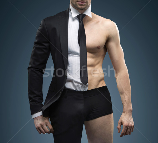 Conceptual image of muscular fit businessman Stock photo © konradbak