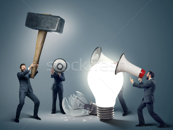 Conceptual image of smart businessmen with symbols Stock photo © konradbak