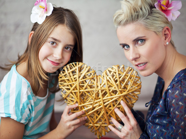 Mother and daughter keeping toy heart Stock photo © konradbak