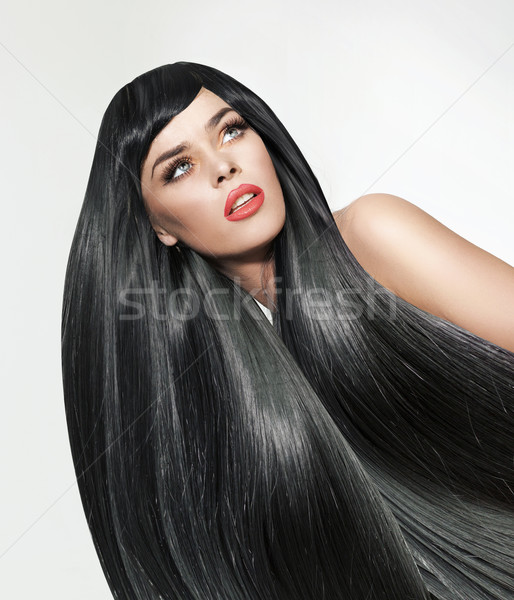 Portrait of a woman with long. straight and bushy hair Stock photo © konradbak