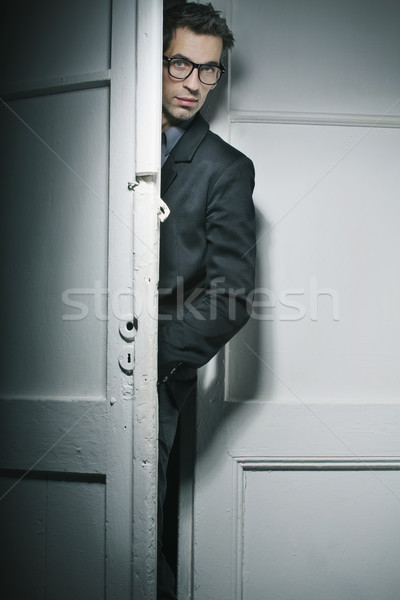Good-looking man behind the door Stock photo © konradbak