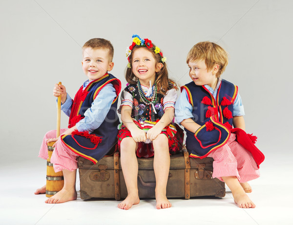 Joyful children wearing national costumes Stock photo © konradbak