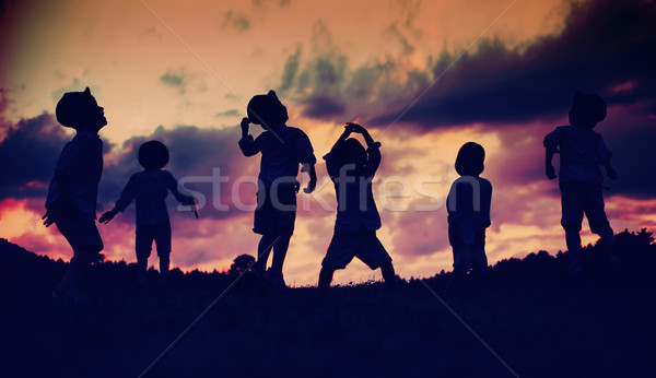 Multiple picture of a cheerful playing boy Stock photo © konradbak