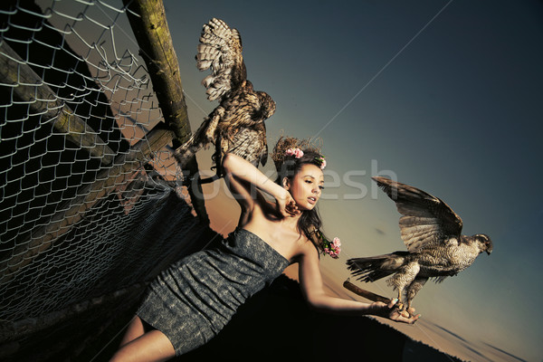 Elegance lady holding eagles Stock photo © konradbak