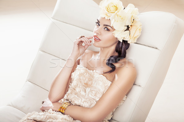 Pretty brunette woman with fabulous flower hat Stock photo © konradbak