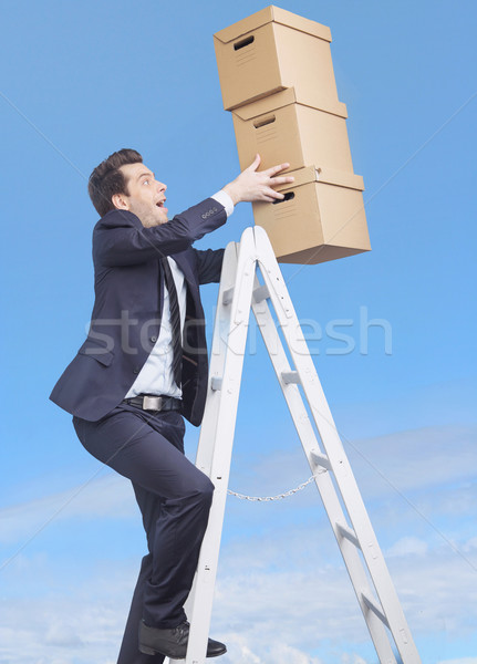 Jeunes gestionnaire cases banquier nuages sourire [[stock_photo]] © konradbak