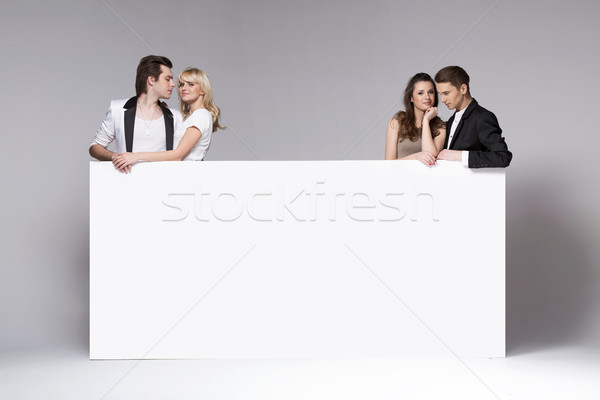 Two couples of friends relaxing together Stock photo © konradbak