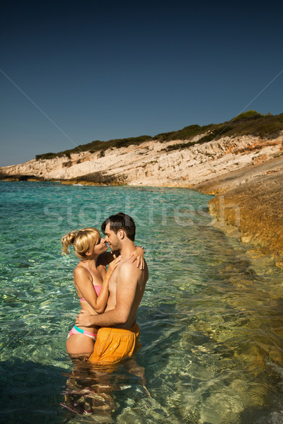 Couple on a tropical beach Stock photo © konradbak