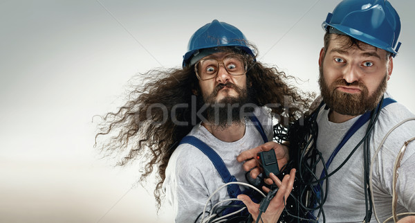 Retrato dois bobo engenheiros trabalhar pintar Foto stock © konradbak