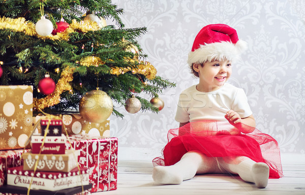 Portrait of a little girl dressed up a santa Stock photo © konradbak