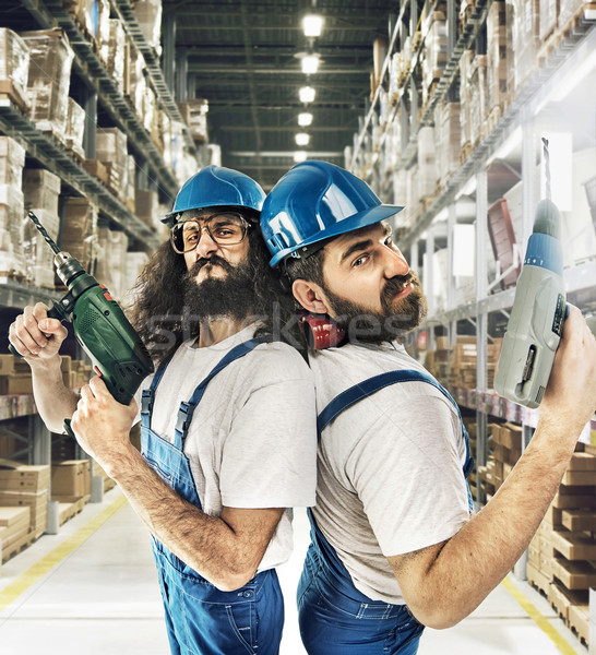 Portrait of two builders in a storehouse Stock photo © konradbak