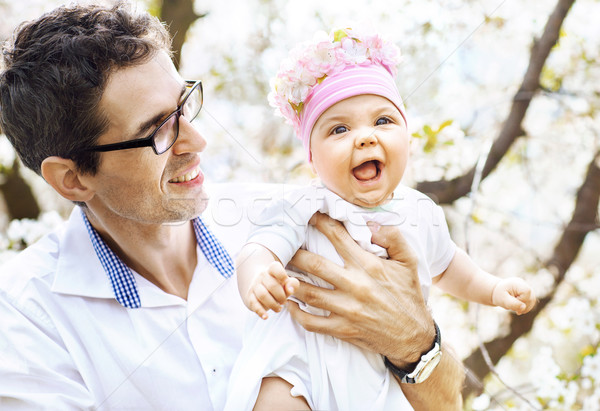 Cheerful father holding his lovely baby Stock photo © konradbak