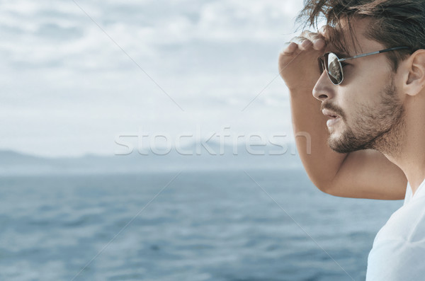 Profile portrait of a handsome man relaxing on the boat Stock photo © konradbak