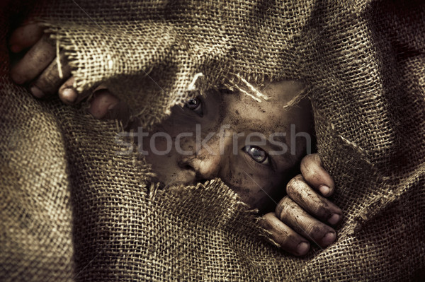 Artistic portrait of a poor little boy Stock photo © konradbak