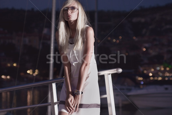  Attractive young woman near the yachts Stock photo © konradbak