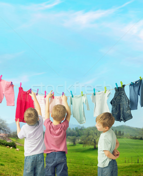 Cute little boys doing the laundry Stock photo © konradbak