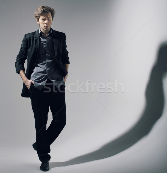 Természetes póz jóképű férfi modell asztal Stock fotó © konradbak