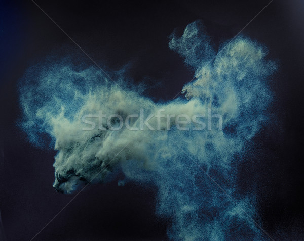 Conceptual cloud of a blue dust Stock photo © konradbak