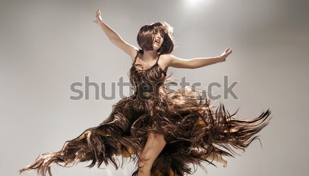 Young woman wearing dress made of hair Stock photo © konradbak