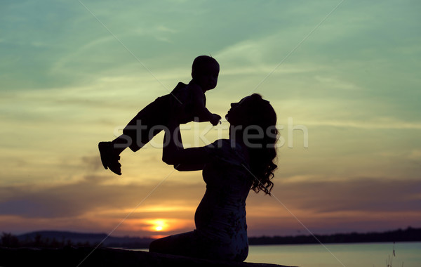 Pregnant mother playing with her child Stock photo © konradbak