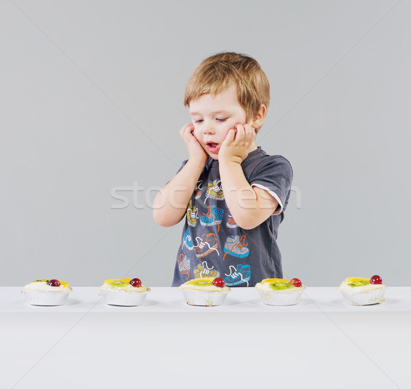 Little boy and a lot of sweets Stock photo © konradbak