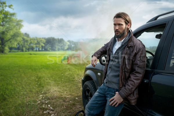 Photo of elegant handsome stylish man near the car Stock photo © konradbak