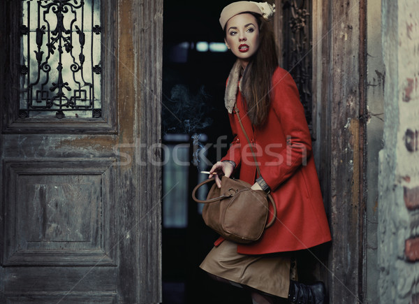 Beauty brunette going out Stock photo © konradbak