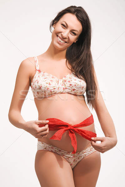 Femme enceinte abdomen femme fille sourire [[stock_photo]] © konradbak