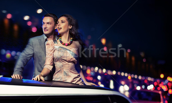 Elegant couple traveling a limousine at night Stock photo © konradbak