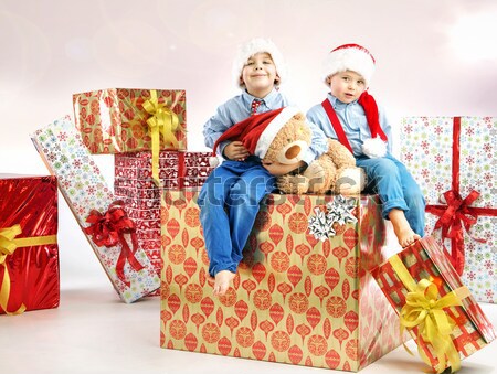 Smiling cute boy holding the gift Stock photo © konradbak