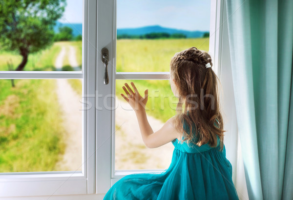 Sad girl looking through window Stock photo © konradbak