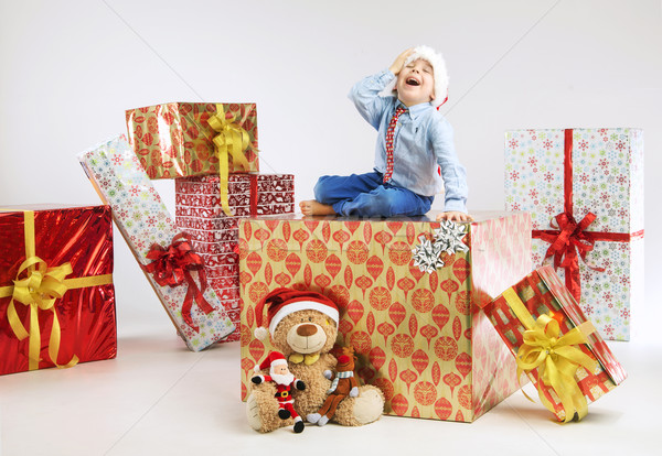 Portrait of little man sitting on the present Stock photo © konradbak