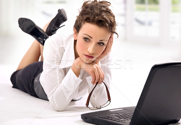 Attractive young businesswoman with notebook Stock photo © konradbak