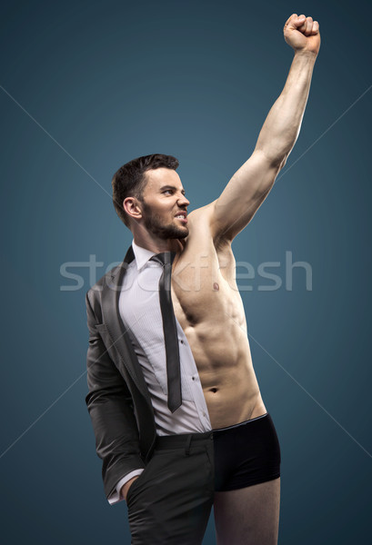 Portrait of a handsome muscular businessman Stock photo © konradbak