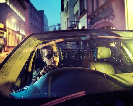 Stock photo: Prett  lady riding across the city in the dead of the night