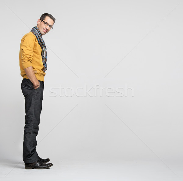 Handsome man casually leaning against the wall Stock photo © konradbak