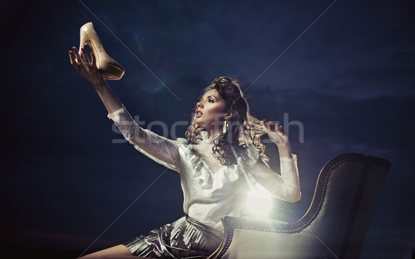 Brunette enjoying her shoes Stock photo © konradbak