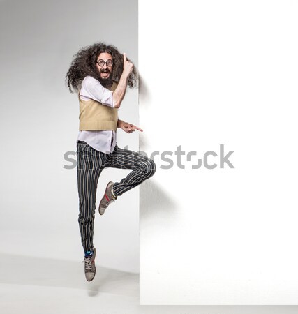 Vogue style photo of a blond beauty over white wall Stock photo © konradbak