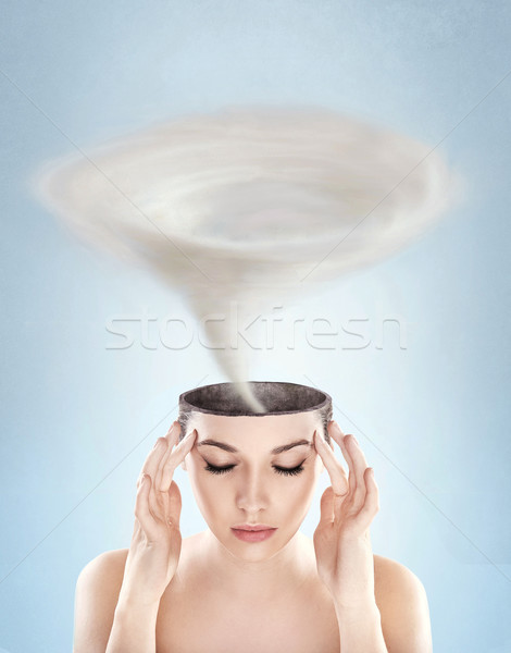 Conceptual picture - tornado in woman's head Stock photo © konradbak