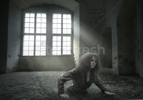 lost woman in the vacated room  Stock photo © konradbak