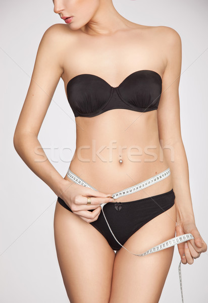 Stock photo: woman measuring perfect shape
