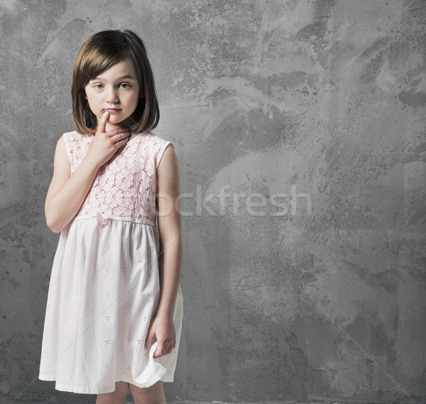 Portrait of a thoughtful little girl Stock photo © konradbak