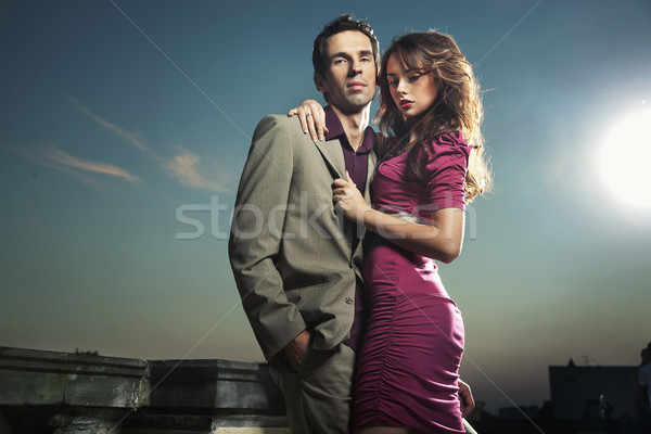 Stock photo: Attractive couple with glasses of wine