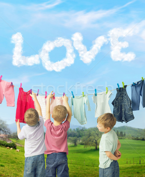 Cute brothers making a laundry Stock photo © konradbak