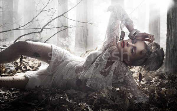 Beautiful lady lying and posing Stock photo © konradbak