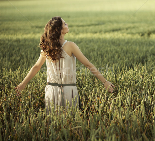 Pretty woman walking on the corn field Stock photo © konradbak